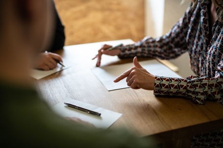 Meeting of 3 people with documents