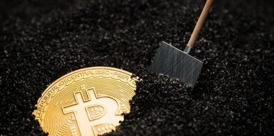 Graphic of a Bitcoin being uncovered under earth via a shovel